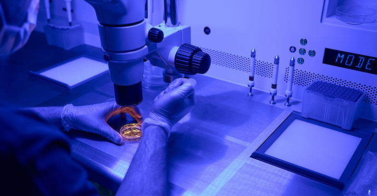 embryologist conducting pgt testing in a lab setting