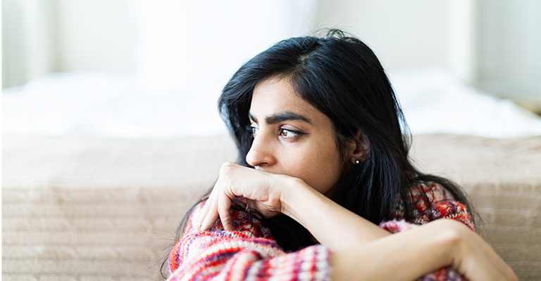 contemplative woman looking towards the side