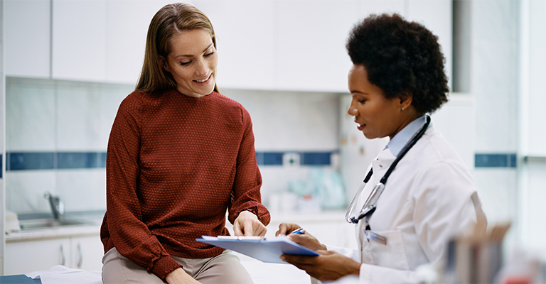 woman discussing women's health with her provider