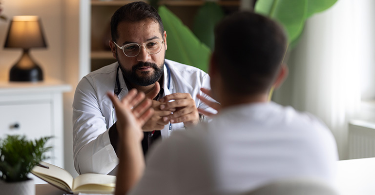 reproductive urologist with male patient