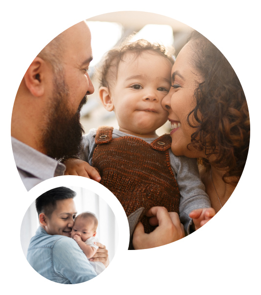 Smiling parents holding baby