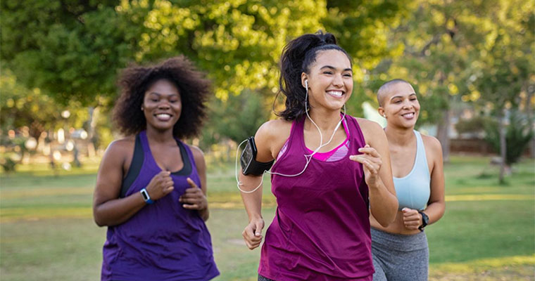 group of women running in the park