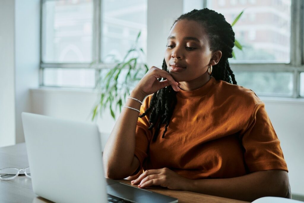 woman evaluating financial models online