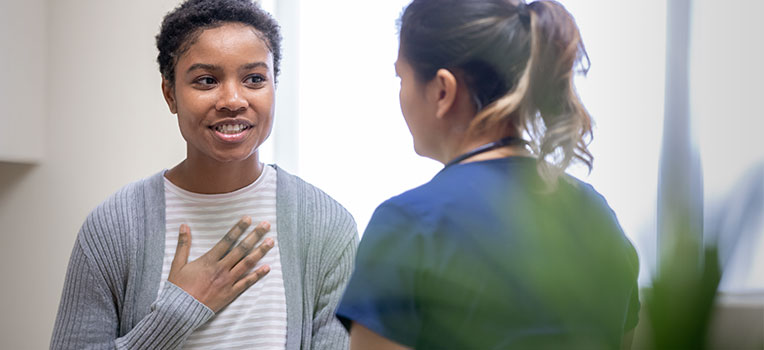 Black woman discussing fertility with her medical provider
