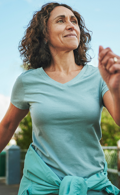 woman in midlife on a vigorous walk