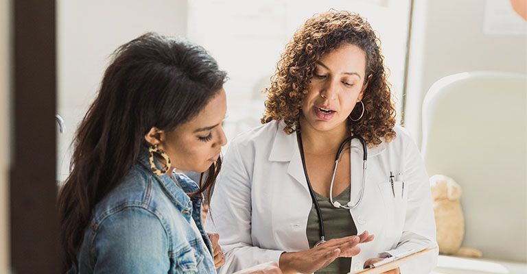 doctor explaining something to patient