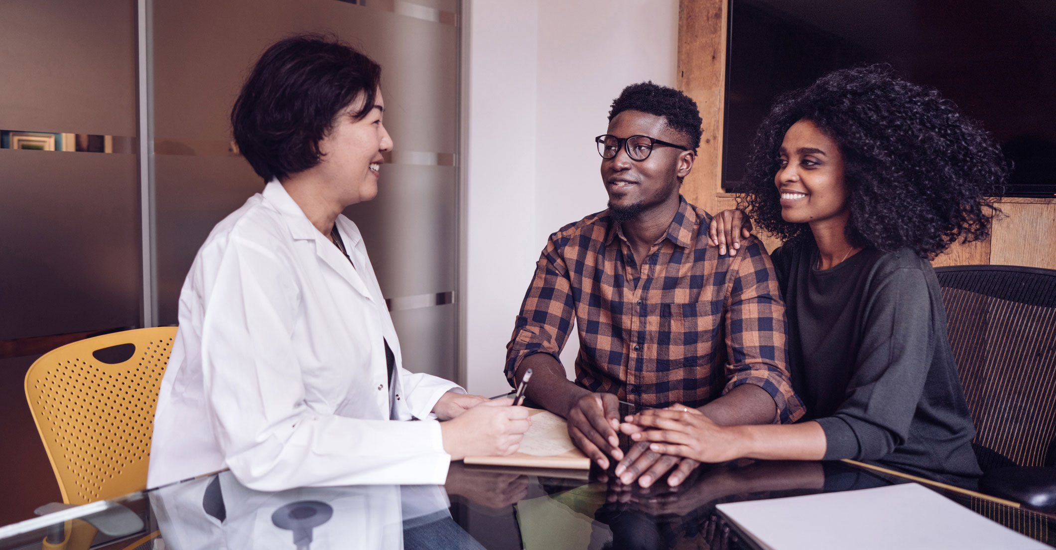 heterosexual couple discussing infertility with provider