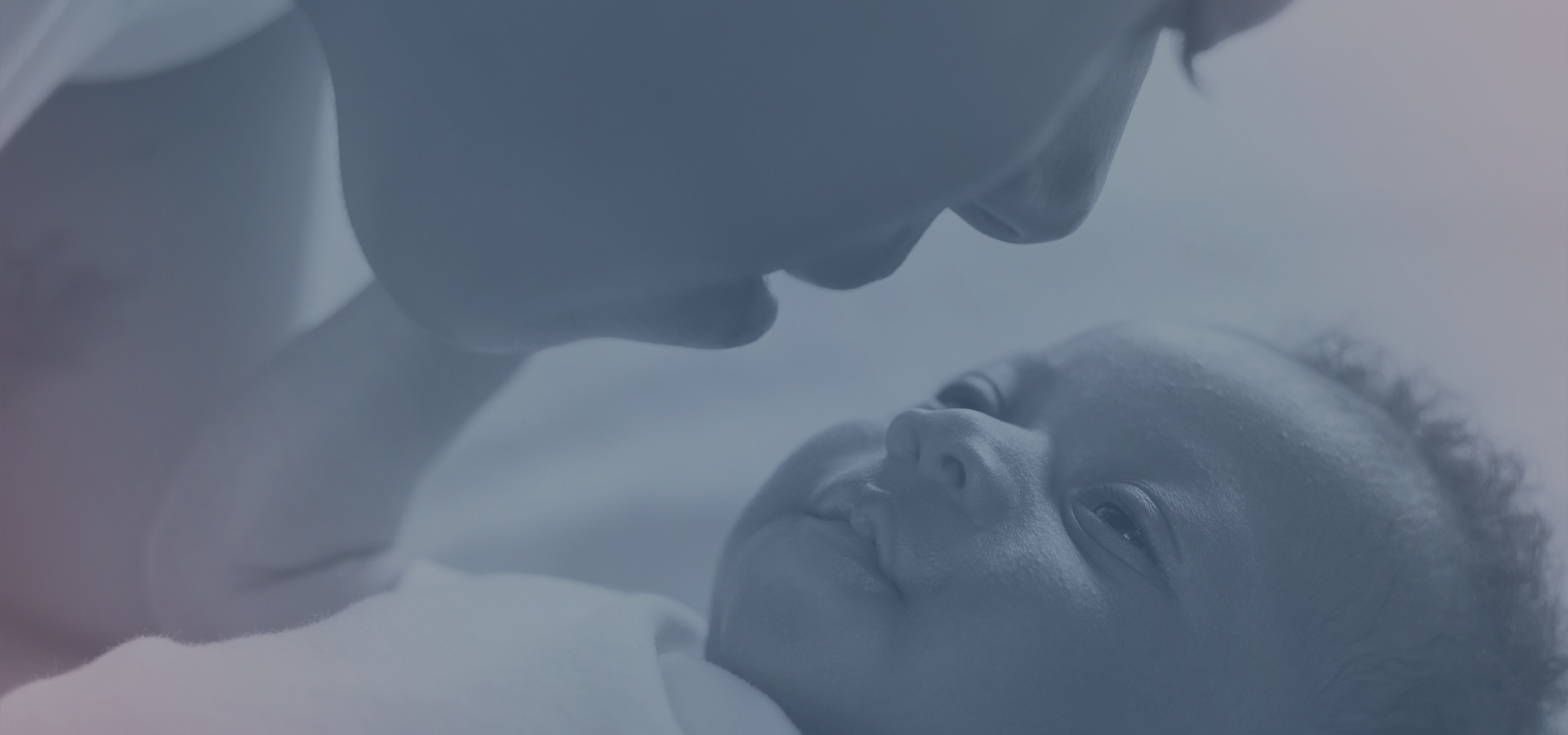 Mother looking at a newborn baby