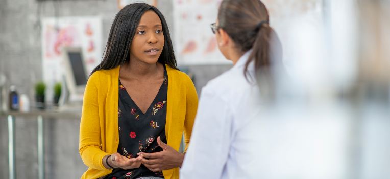 woman discussing fertility options with her doctor