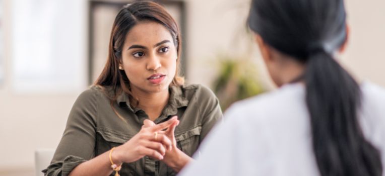 woman deep in discussion with her friend
