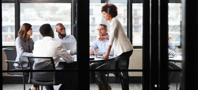 woman making a presentation at work in a conference room