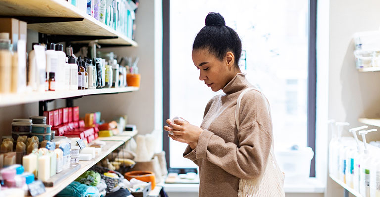 woman evaluating products in store