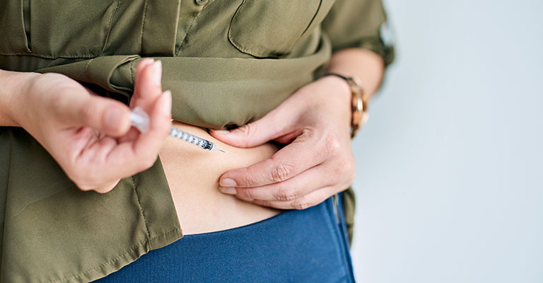 woman injecting her side