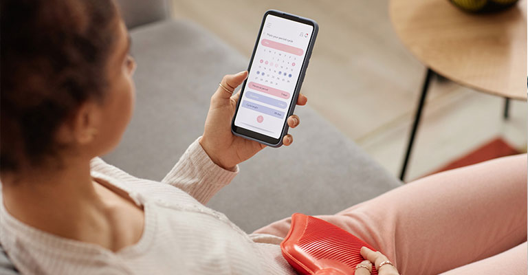 woman with fertility tracking app