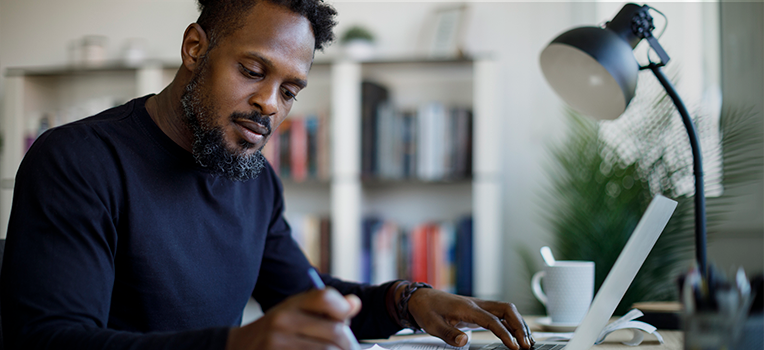 seated man reviewing papers