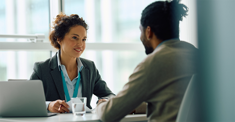 Female human resource manager communicating with employee in the office