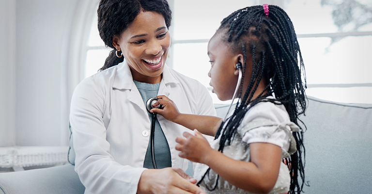 pediatrician at children's hospital with child patient