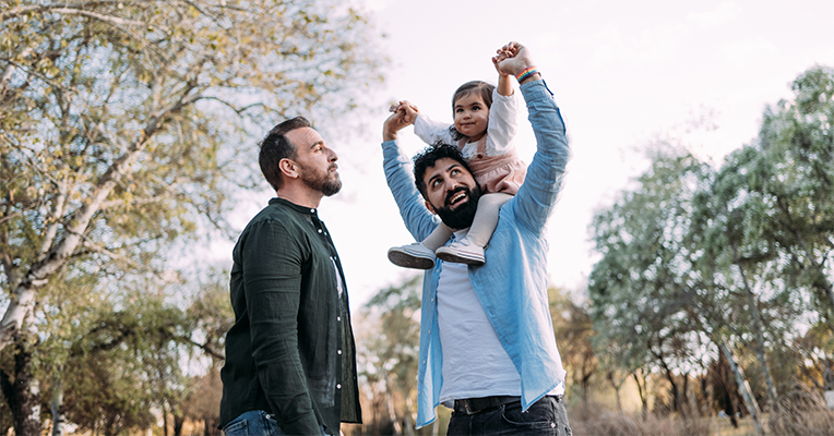 same sex male couple with their child