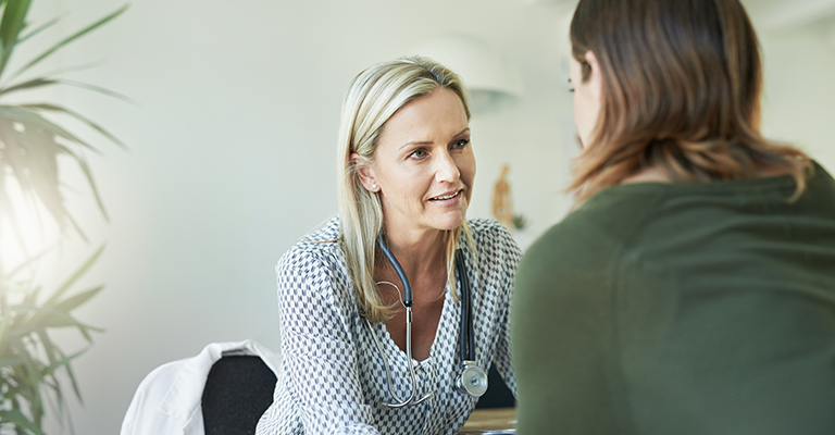 seated female doctor counseling patient