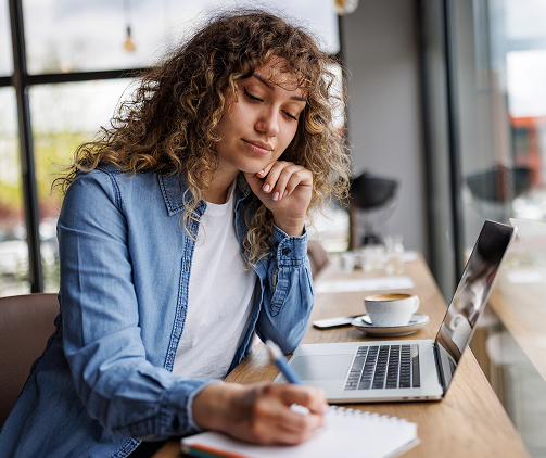 woman researching on laptop