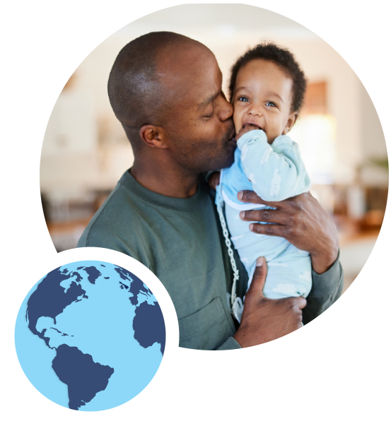 father with infant with a graphic of a globe