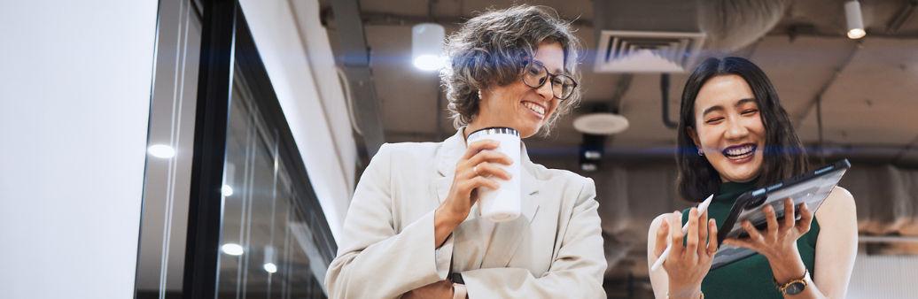 two happy women in the workplace