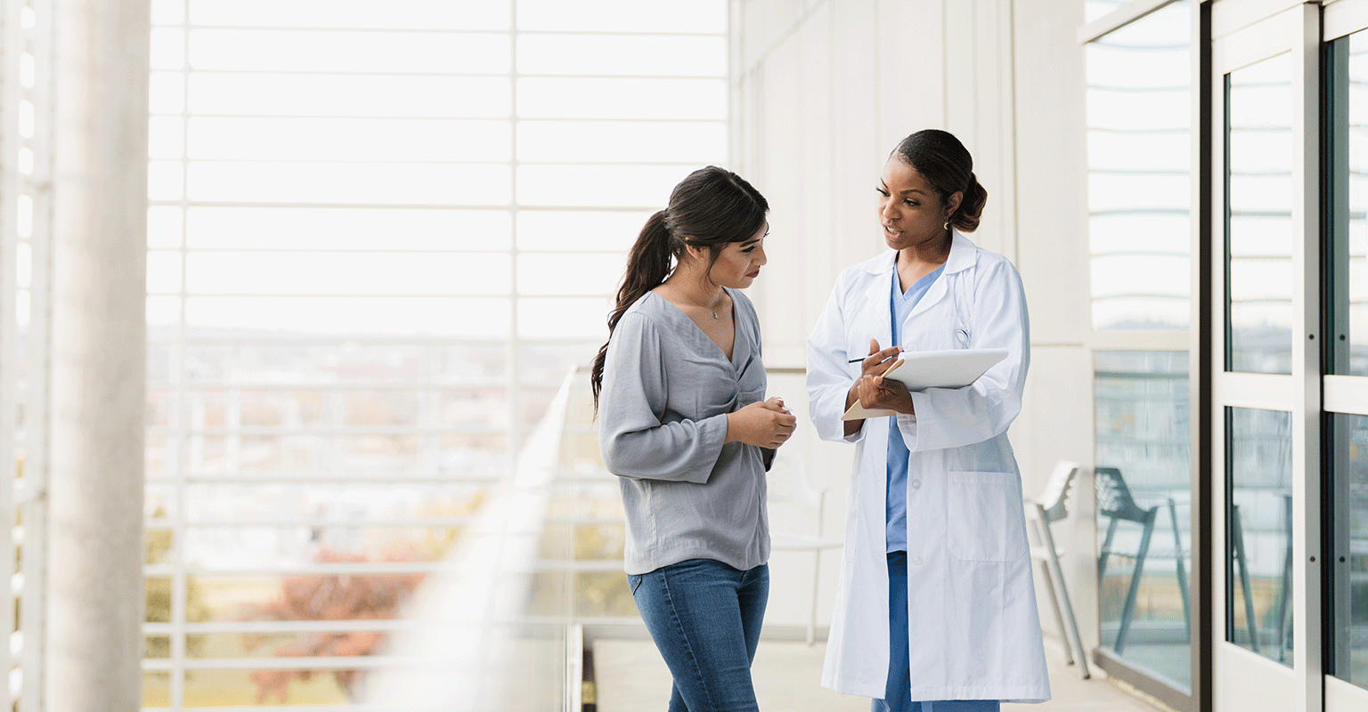 woman discussing frozen embryo transfer with her provider