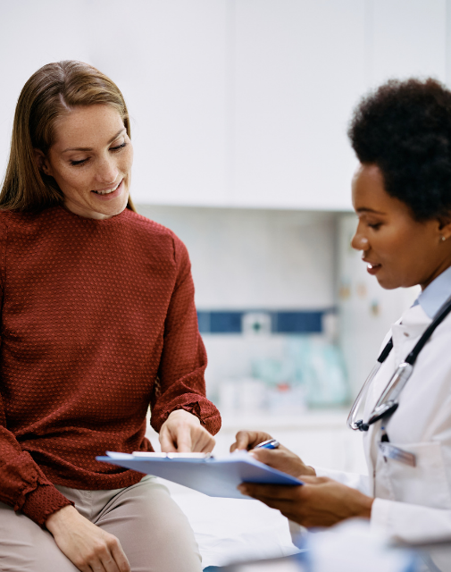 woman meeting with her doctor